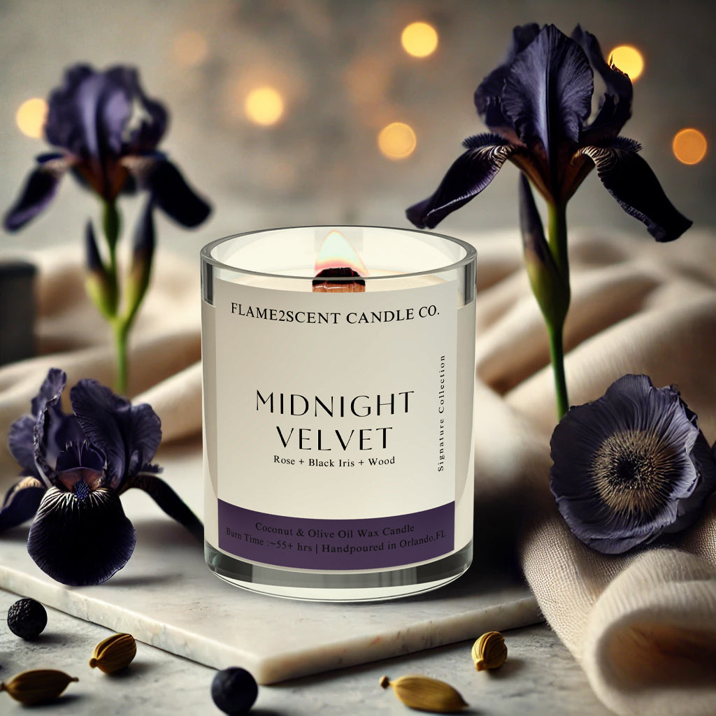 Midnight Velvet coconut wax candle with purple label, lit wood wick, and floral notes