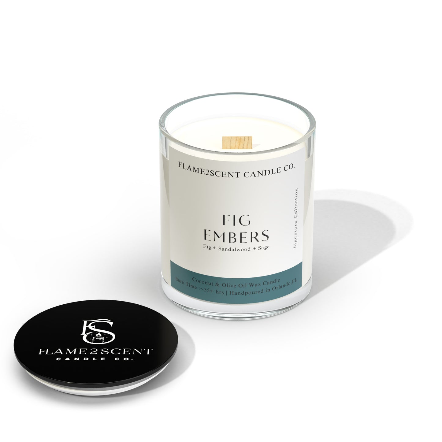 Fig Embers candle in teal label, lit wood wick and earthy blend of fig and sage