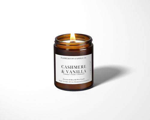 cashmere and vanilla scented wood wick candle made with coconut apricot wax in amber jar with black lid