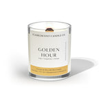 clean burning grapefruit and citrus scented coconut apricot wood wick candle in clear glass jar with black lid