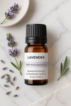 Lavender essential oil bottle with lavender flowers on a marble surface